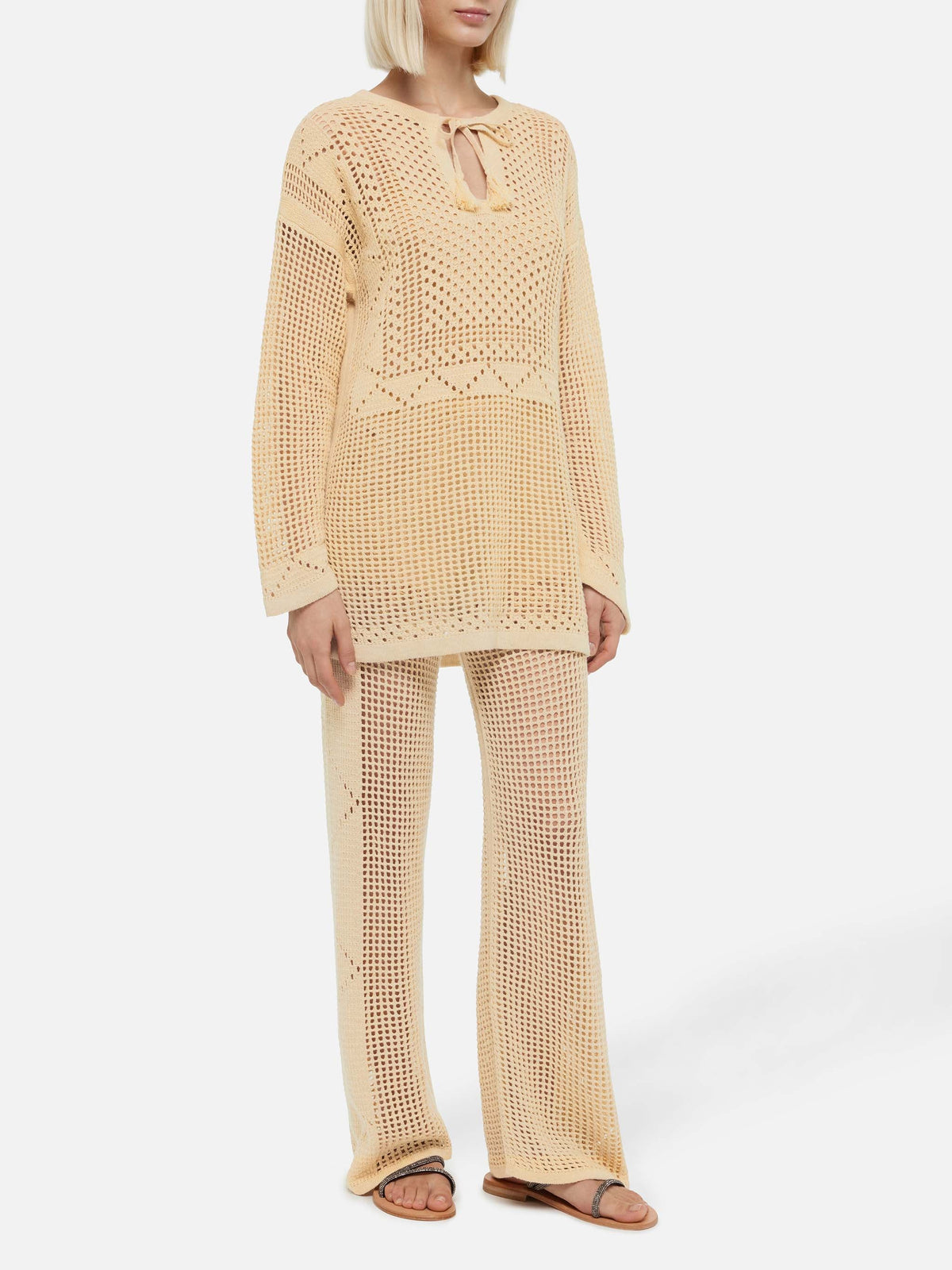 Pantaloni a zampa Alva beige in crochet