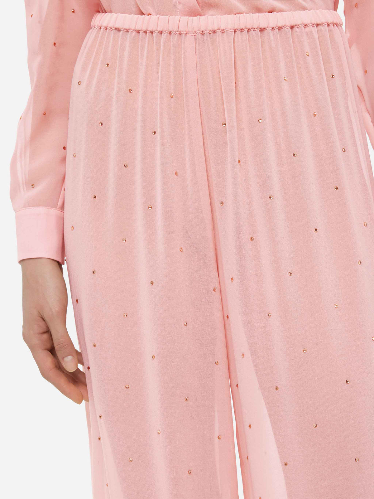 Pantaloni Amalia rosa a gamba ampia in georgette con strass