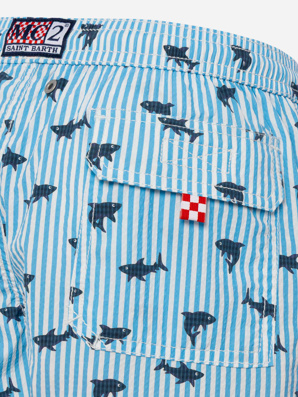 Costume mare Patmos Jr azzurro a righe in seersucker con stampa squali